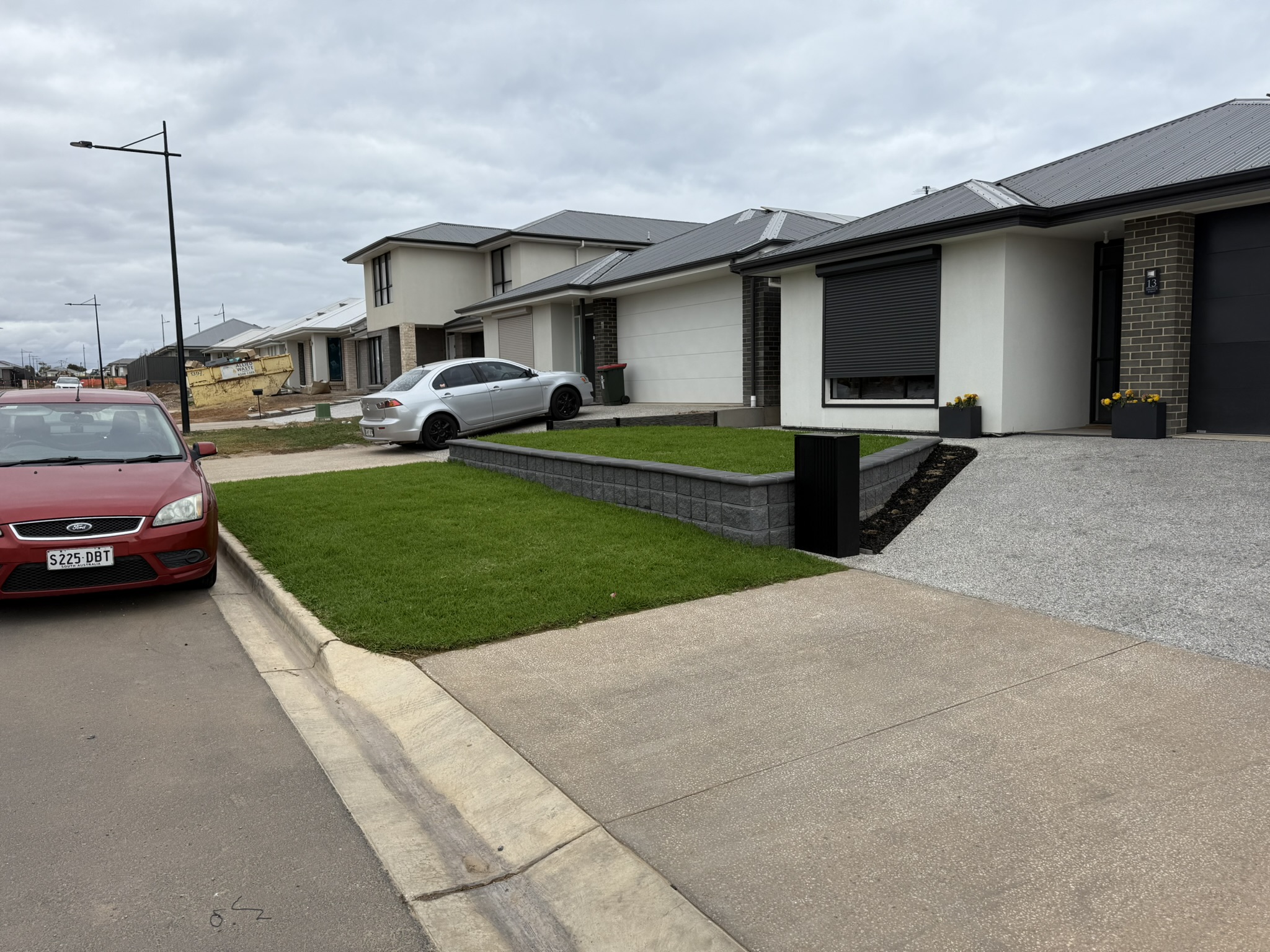 Landscaping Seaford garden with retaining wall and turf installation